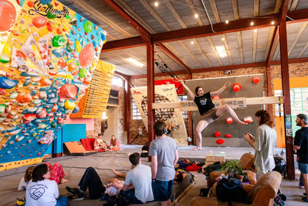 Climbers on the moonboard at Friends & Allies